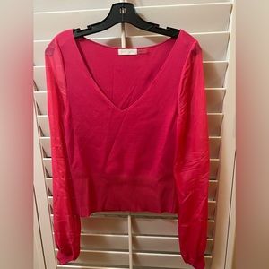 Bright pink Ramy Brook sweater with sheer sleeves